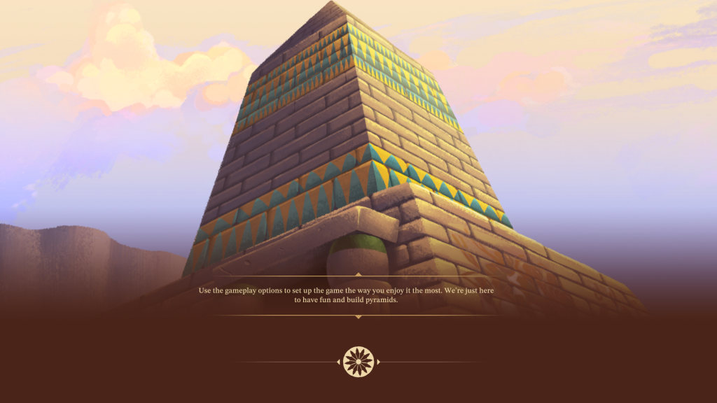 A stylized image of a loading screen from Pharaoh: A New Era. A stele stands in front of a cloudy, pastel sky. The stele is made of tan bricks and is painted with two strips of pattern- one at the top and one at the bottom. The pattern is tesselating blue and yellow triangles. Below the stele, a loading screen message says, "Use the gameplay options to set up the game the way you enjoy it the most. We're just here to have fun and build pyramids."