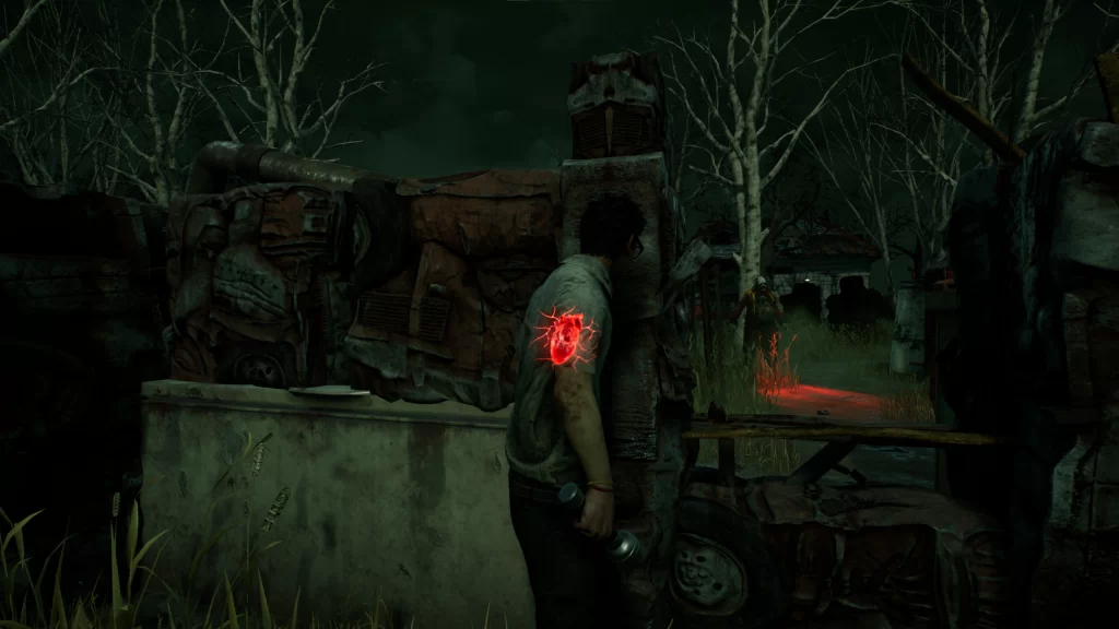 An image of Dead By Daylight's terror radius visualization. The image shows a spooky, run-down fence surrounded by trees. The player character- a young man with dark hair, glasses, light skin, and a short-sleeved collared shirt- stands in the center of the image. A glowing, red, realistic heart hangs in his chest. This heart is the terror visualization.