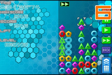 An image of gameplay from Planet Puzzle League. The game consists of coloured triangles, diamonds, circles, pentagons, and hexagons on a playing field.